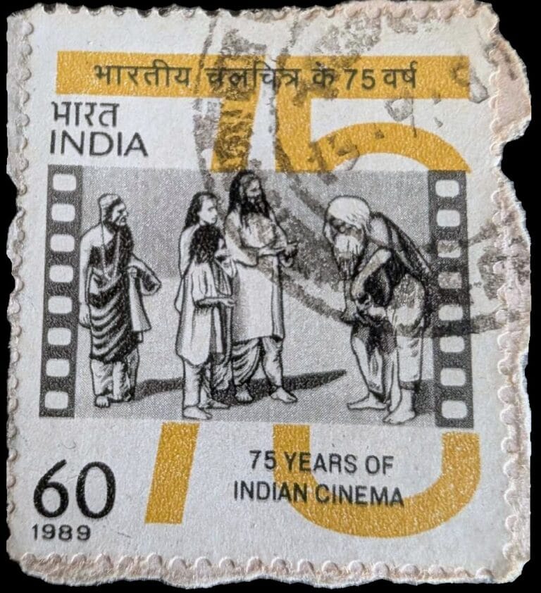 1989 Indian cinema stamp from India Post, 60 paise, showing an illustrated scene from Raja Harishchandra framed by a film-strip border and gold "75" numeral
