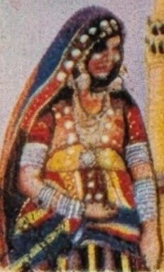 Macro detail of the Charminar stamp showing the woman's embroidered ceremonial dress and individually printed white pearl strands against the sky