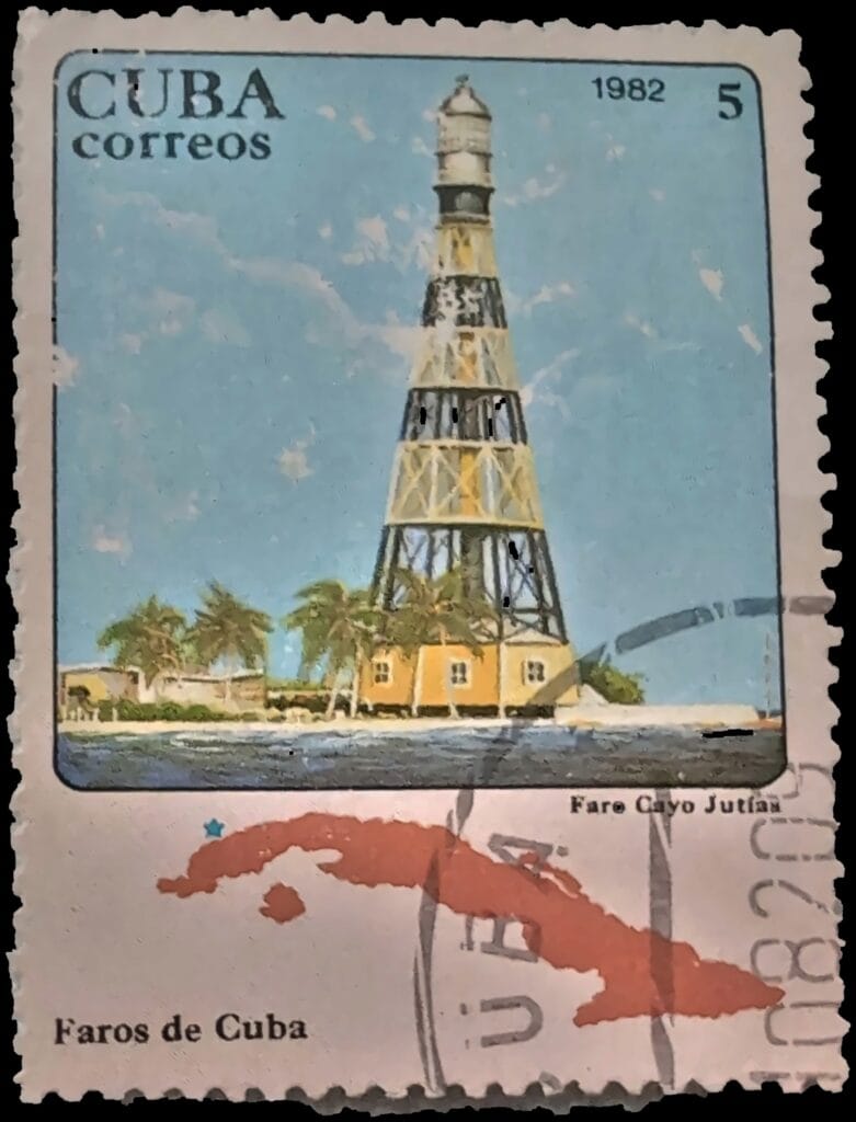 Faro Cayo Jutías stamp, Cuba 1982, 5 centavos — lattice lighthouse tower, keeper's house and palms with an outline map of Cuba