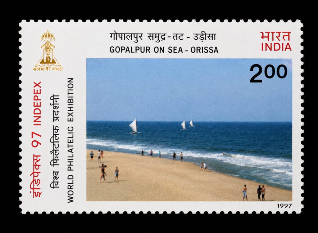 Gopalpur stamp 1997, ₹2 Indian postage stamp showing sailboats and beachgoers at Gopalpur-on-Sea, Orissa, INDEPEX '97 series