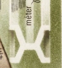 Macro of the X-shaped Tresca cross-section and vertical méter lettering on the 1976 Hungarian metric system stamp, one forint, reversed in white on olive