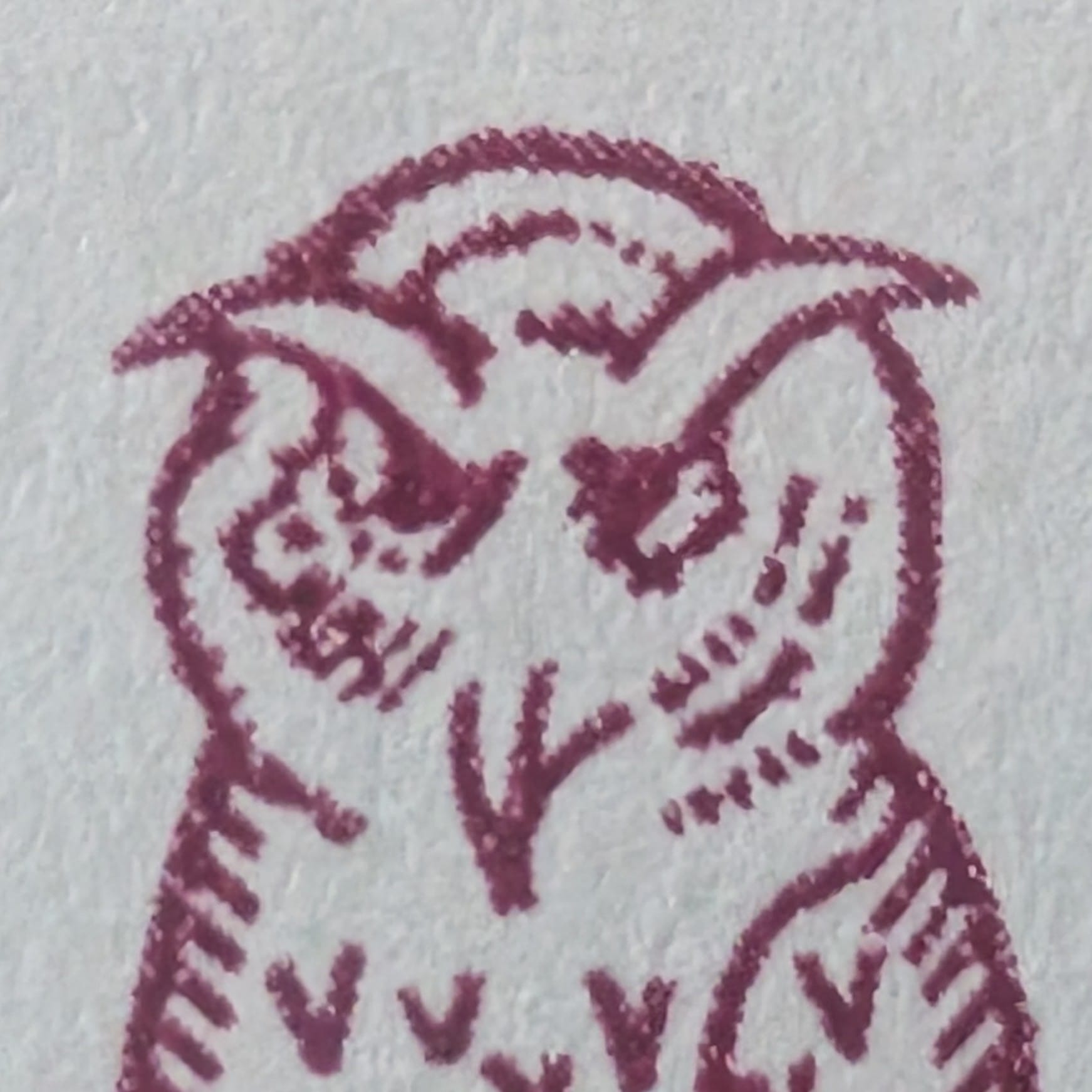 Macro detail of the owl's hooded half-closed eyes and ear tufts on the 1998 Defence Services Staff College stamp