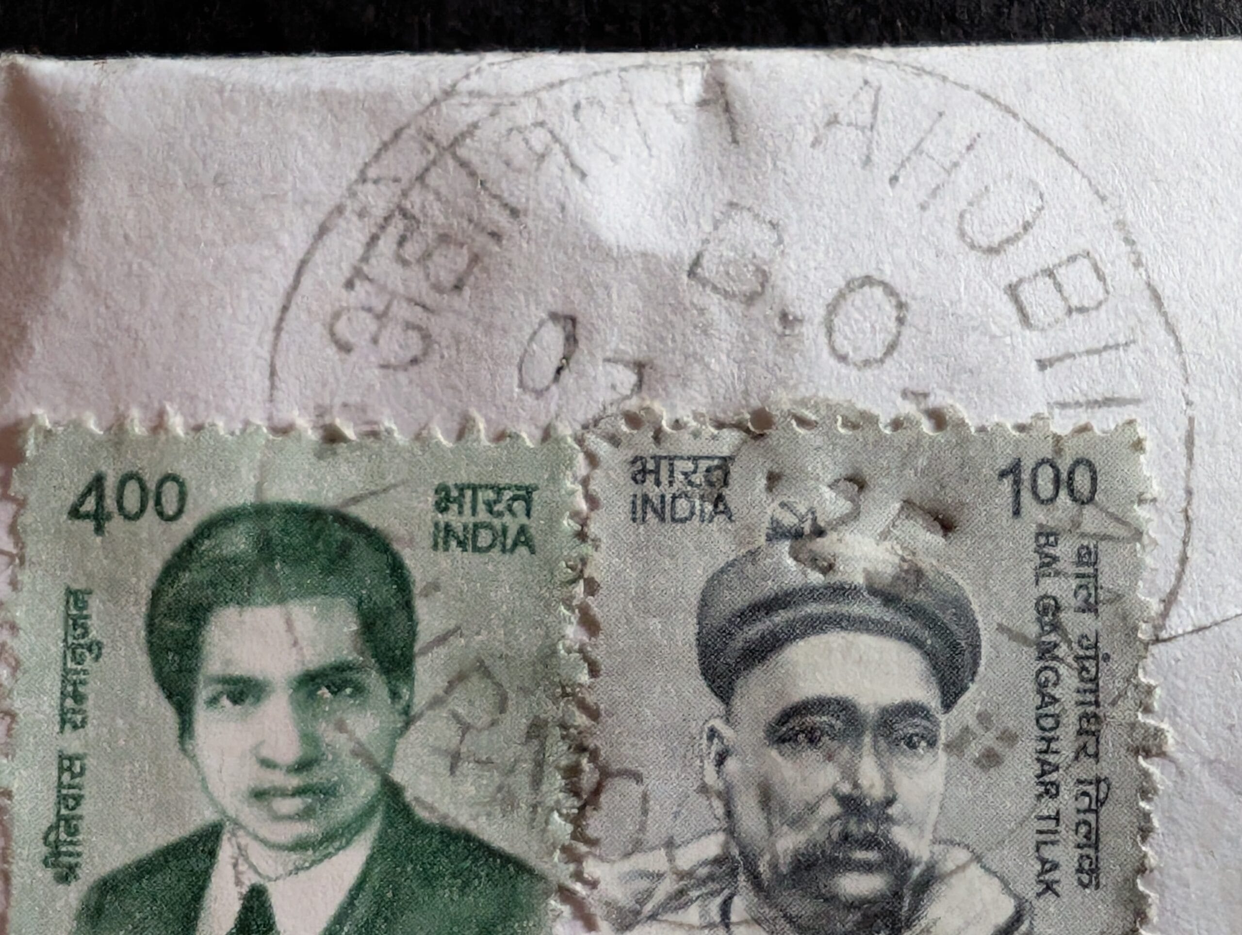 The AHOBILAM B.O. circular datestamp struck across the cover paper beside the two definitive stamps