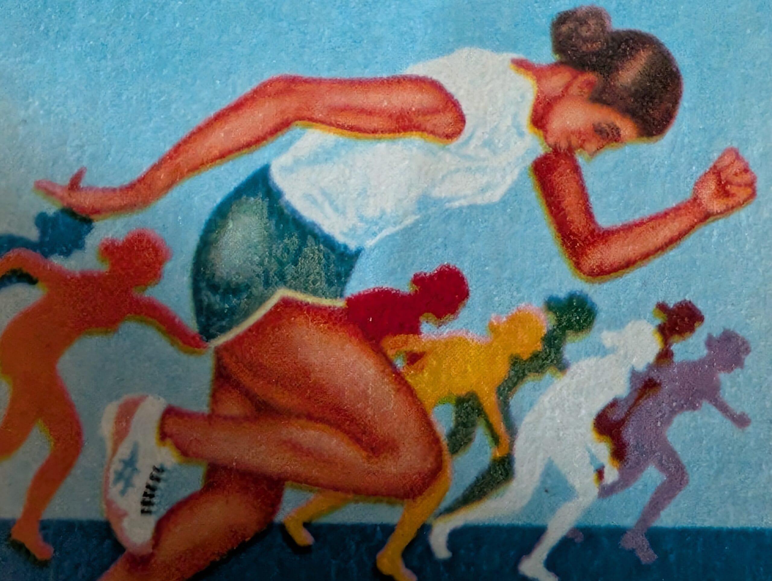 Macro of the receding chain of red, yellow, green, white and violet running figures on the 1990 India XI Asian Games stamp