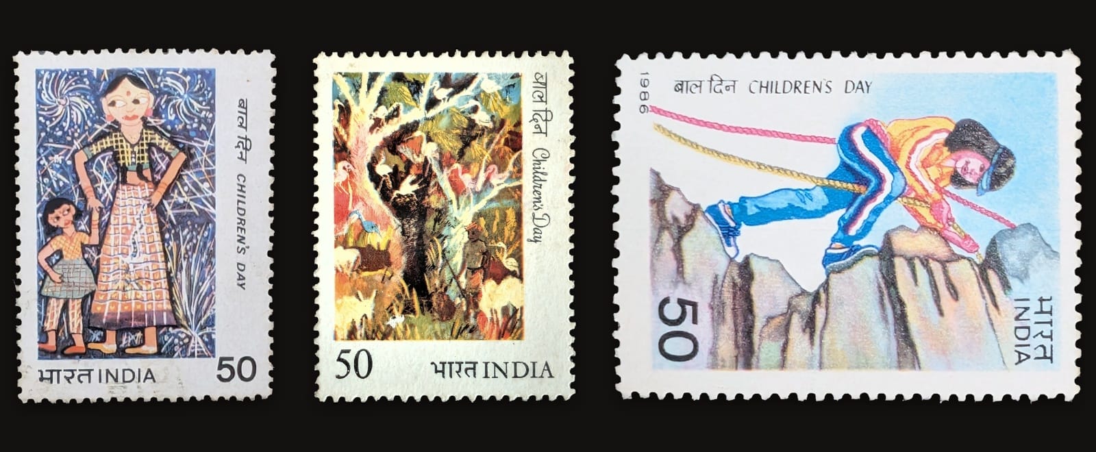 Three Indian Children's Day stamps in a row - a festival scene, a herdsman in forest, and a girl rock climber, all painted by schoolchildren