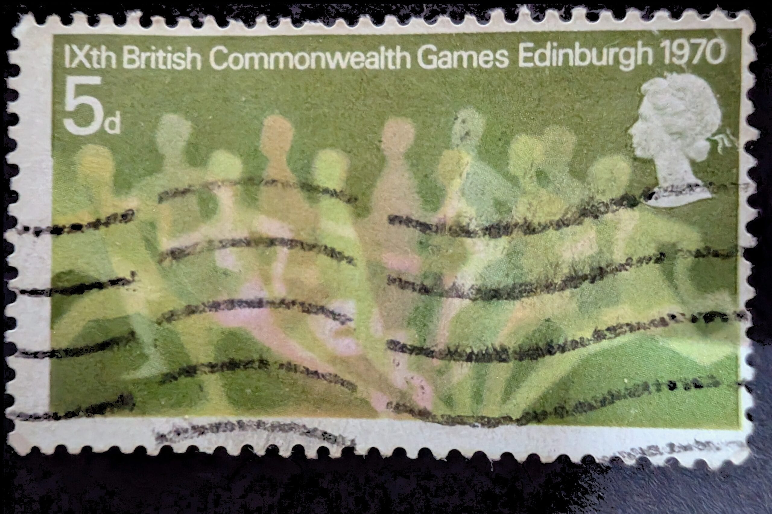 The complete 1970 British Commonwealth Games Edinburgh 5d stamp, green, a line of blurred runners at the tape below the title with the Queen's silhouette at right, wavy machine cancellation across the face