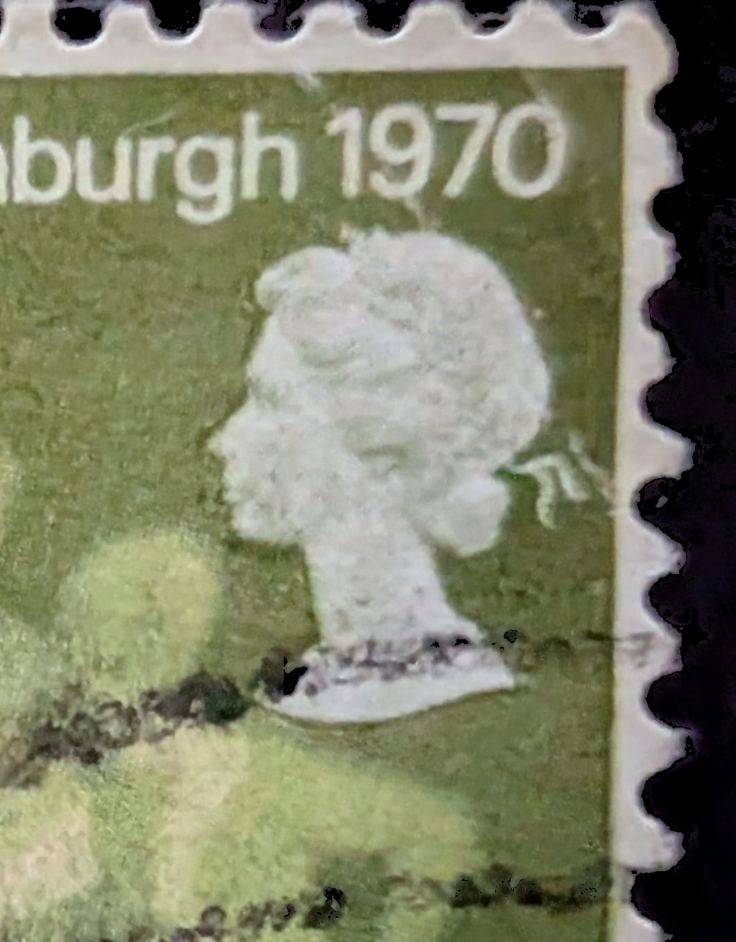 Macro of the sculptural Machin-style head of Queen Elizabeth II at the top right of the 1970 Commonwealth Games stamp, above the wording Edinburgh 1970