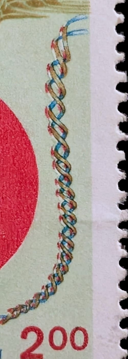 Macro of the red, blue and gold DNA double helix curving down the right edge of the 1996 India Crop Science Congress stamp beside the 2.00 value