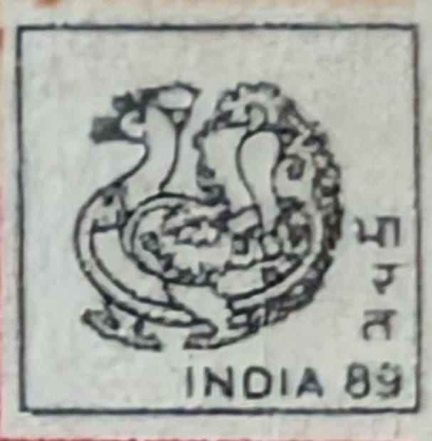Macro photograph of the small institutional emblem appearing in the lower right corner of the World Philatelic Exhibition 1989 stamp design