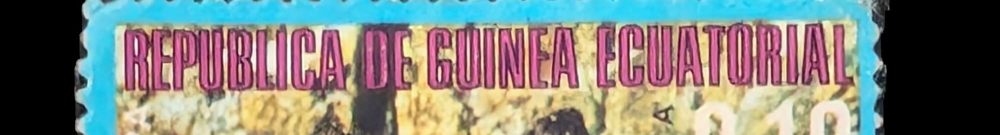 Macro of the magenta Republica de Guinea Ecuatorial masthead on the 1970s owl stamp