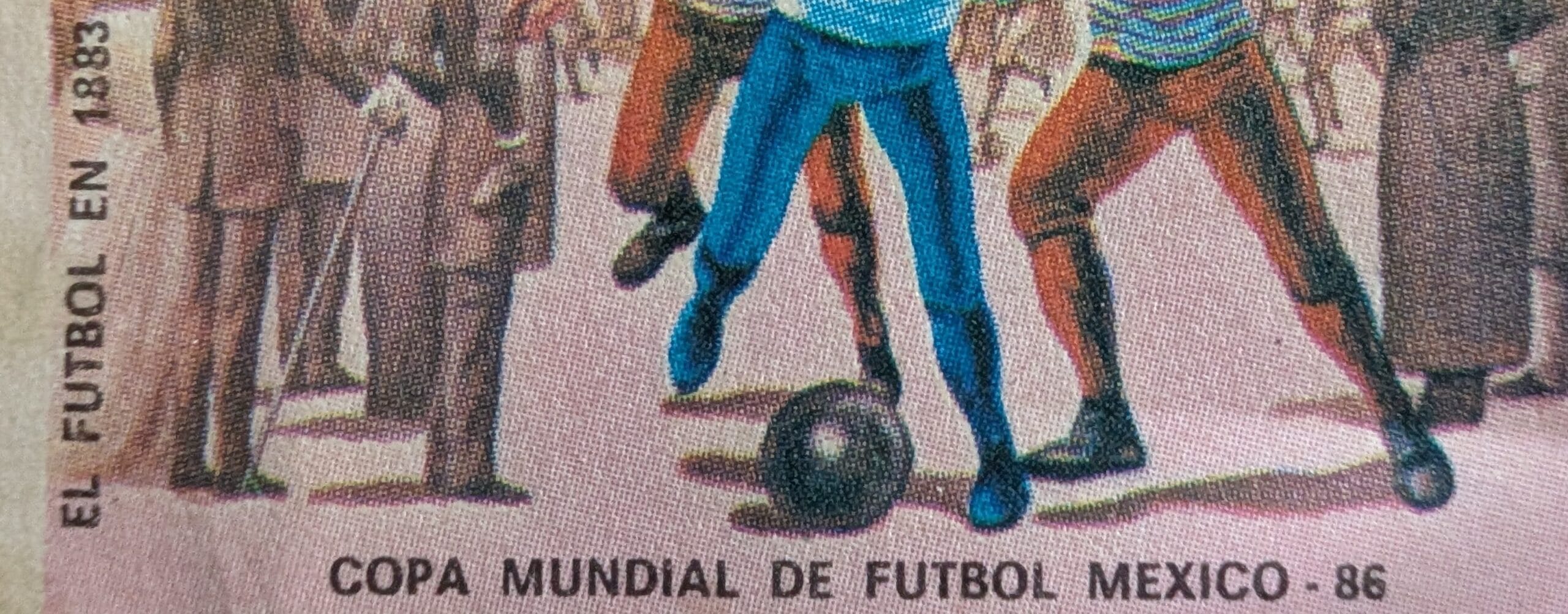 Macro of the vertical caption EL FUTBOL EN 1883 running up the left margin of the 1985 Nicaragua football stamp
