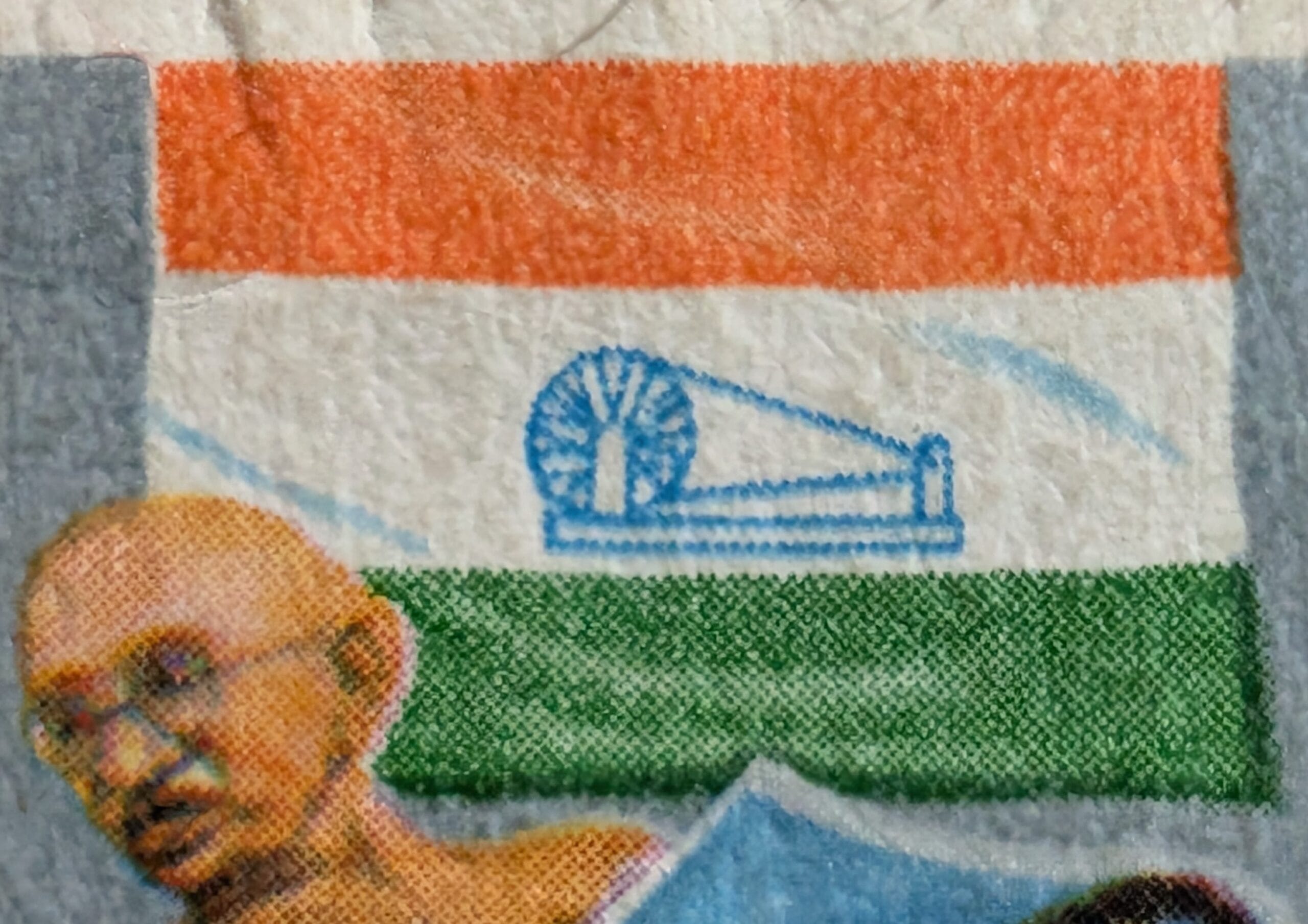 The Congress tricolour with its blue spinning wheel on the Quit India Resolution stamp 1983, the 1942 party banner reproduced by India Post in 1983