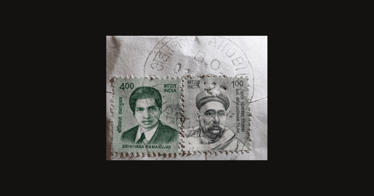 Srinivasa Ramanujan stamp beside a Bal Gangadhar Tilak definitive on an envelope corner, shown on a dark background as the article's featured image